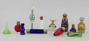 A silver plate and ruby glass perfume bottle, late 19th/early 20th, the top stamped to the interior T Russell, 12.5cm long, together with a bottle ended bottle