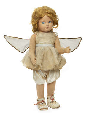 
	
		A Norah Wellings fairy doll, wearing a pale ivory dress and knickerbockers, with white...
