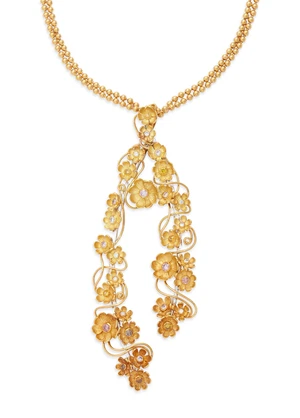 A diamond and coloured diamond necklace, the pendant decorated with floral clusters set with...
