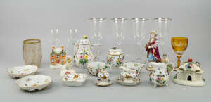 A Continental porcelain flower encrusted tea service, late 19th/early 20th century, to comprise tea pot and lid, sugar pot and lid, two cups and saucers and mi