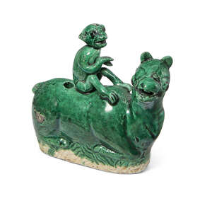 A Chinese biscuit porcelain water dropper, Kangxi period, modelled as a monkey sat atop a recumbent horse, with allover apple-green glaze, 9cm long
		 
		Pr