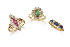 A group of three diamond and gem rings, comprising: an Edwardian, 18ct. gold, ruby and diamond marquise cluster ring set with three central cushion-cut rubies 
