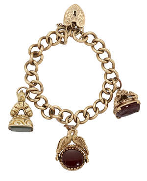 A 9ct gold charm bracelet, of curb-link design with 9ct gold padlock clasp suspending three fob...