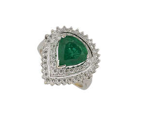 
	
		An emerald & diamond cluster ring, the claw-set central pear-shaped emerald with...