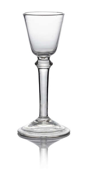 A George II plain stem wine glass, c. 1740, with round funnel bowl with triple annulated shoulder knop, on conical folded foot, 15cm high
		 