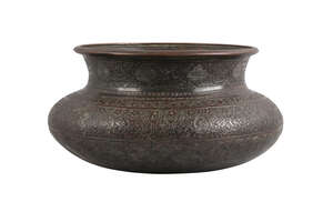 
	
		A Safavid tinned copper bowl, Iran, 17th century, of squat form, the body engraved with...