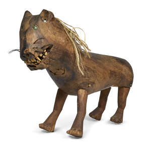 
	
		A folk art carved hardwood model of a lion, 19th century, with inset glass eyes, coarse...