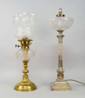 
	
		An early 20th century silver Corinthian column base oil lamp, later converted to...