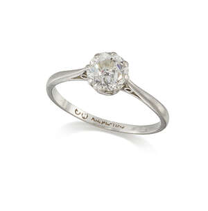 A diamond single stone ring, the single old-brilliant-cut diamond weighing approximately 1.08 carats, in platinum claw-set mount and plain hoop, circa 1930, ri