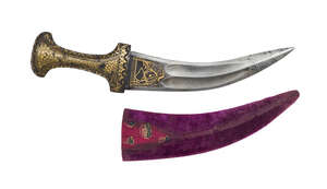 A damascened hilt jambiyya, Deccan, late 19th century, the curved steel blade with three ridges narrowing to a central ridge toward end, the upper section with