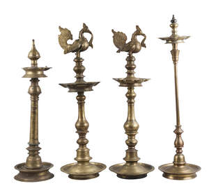 
	
		A group of brass oil lamps, some inscribed, India, 19th/20th century, of tiered form,...