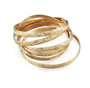 Six bangles, of matching hoop design with scroll decoration, one split
		 
