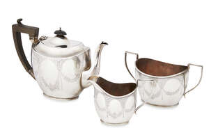 
	
		A silver three piece tea set, Birmingham c.1914, Joseph Gloster Ltd., of ovoid form,...