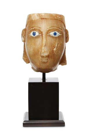An alabaster head with inlaid eyes, South Arabia, 1st century B.C.  1st century A.D., South Arabia, Kingdom of Saba, with tapering columnar neck, oval face wit
