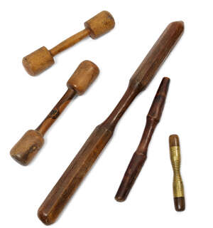 
	
		A group of four pestles, comprising: a large lignum vitae double ended pestle, 50cm long,...