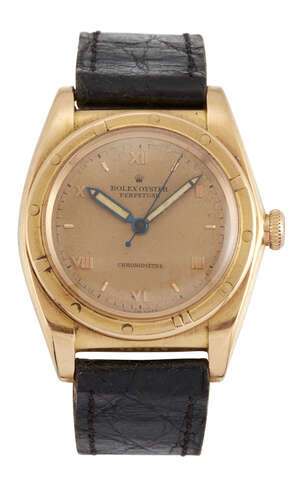
	
		A rose gold 'Oyster Perpetual' 'Bubble back' wristwatch by Rolex Ref. 3372, the gilt dial...