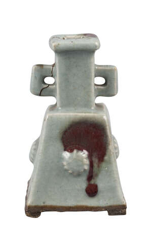 A Chinese stoneware Guangdong ware square vase, with square handles to narrow neck, the tapering body with purple splash and four floral bosses, 15cm high