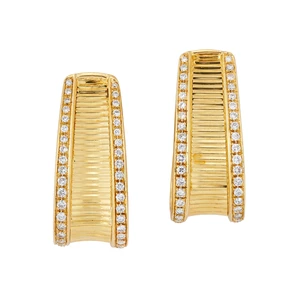 Kutchinsky. A pair of diamond set hoop earrings, of elongated, tapering form, with ridged...