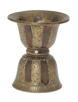 
	
		A small copper inlaid brass spittoon, South India,18th century, of waisted form, the...