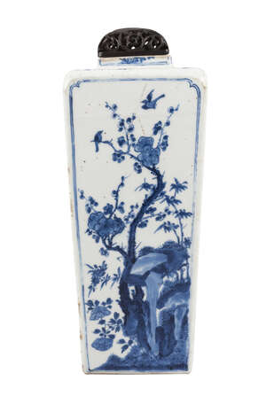 A Chinese porcelain square vase, Kangxi, of shouldered, tapering form, painted in underglaze blue to each side with prunus blossom, peonies, lotus, and chrysan