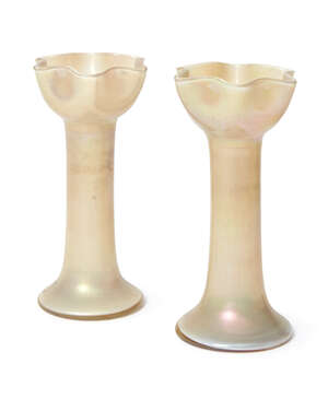
	
		A pair of cased iridescent glass vase, first half 20th Century, each with wavy rim, the...