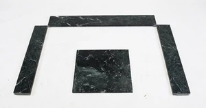 A deconstructed sectional green marble fire surround hearth, 20th century, with additional green...