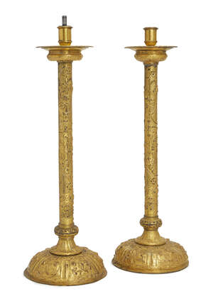 
	
		A pair of Italian gilt-copper and brass candlesticks, 19th century, in the 17th century...