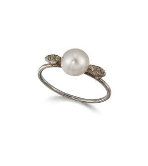 A diamond & pearl ring, the central cusp-mounted bouton pearl with old-brillaint-cut diamond three stone shoulders and plain hoop, circa 1910, ring size L1/2

