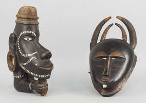 
	
		A Solomon Islands canoe prow figure head, in the form of a man, with elongated nose and...