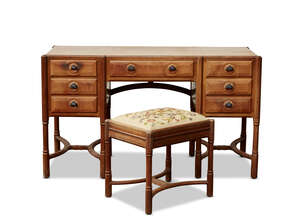 
	
		Gordon Russell (1892-1980), an English walnut Sudeley dressing table and stool
		1929,...
