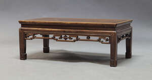 
	
		A Chinese hardwood low table, second half 20th Century, the rectangular top above pierced...
