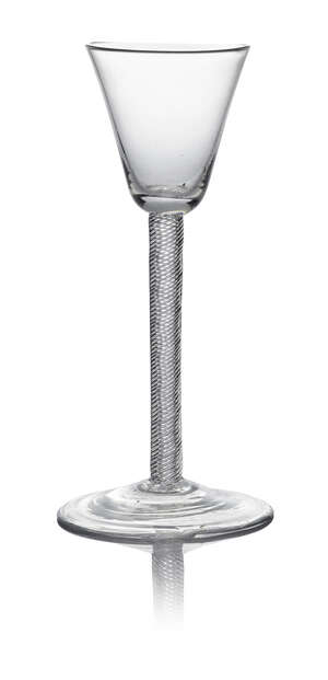 A George III wine glass, c. 1760, with round funnel bowl above an incised stem standing on a plain conical foot, 16cm high