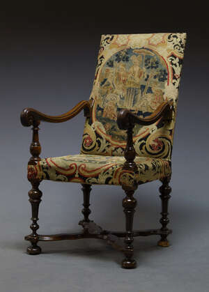 
	
		A French walnut high back armchair, 17th Century,  with needlework upholstery, the...
