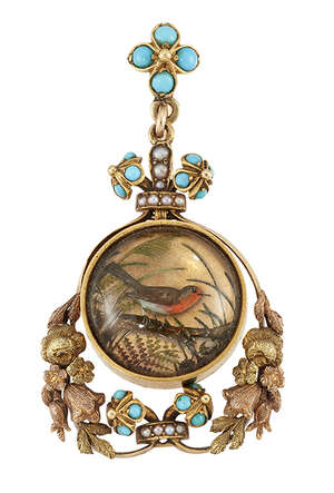 An Edwardian gold, reverse painted crystal intaglio pendant/pin, the central circular intaglio painted to depict a robin on a tree branch with locket reverse, 