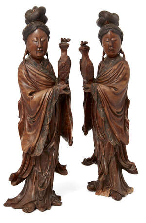 
	
		A pair of Chinese carved hardwood figures of Guanyin, early 20th century, modelled...
