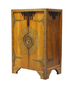
	
		Carlo Bugatti (1856-1940), a walnut, ebonized wood, pewter and brass inlaid and hammered...