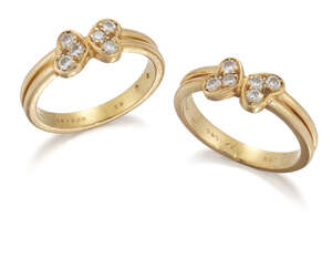 
	
		Cartier, a pair of  twin heart cluster rings, by Cartier,  each set with six pave...