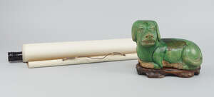
	
		A Chinese Ming-style green-glazed pottery figure of a reclining dog, 20th century, 12cm...