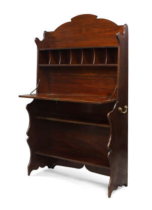 
	
		An Edwardian mahogany bureau cabinet, with shelf above pigeon holes and fall front...