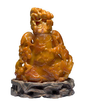 
	
		A Chinese amber vase and cover, late Qing dynasty, carved with grapes and squirrels, on...