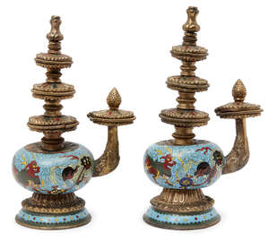 
	
		A pair of Chinese Tibetan-style cloisonné ewers, the globular bodies decorated with...