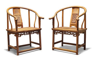 
	
		A pair of Chinese horseshoe backed arm chairs, late Qing dynasty, with central carved...