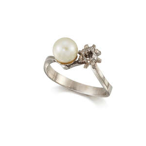 
	
		A diamond and pearl two stone ring, of crossover design, set with a single cushion-shaped...
