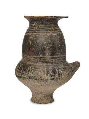 An Etruscan impasto ware biconical urn, circa 9th-8th Century B.C., of burnished black fabric, the tall bulbous neck with incised meander and dot decoration, w