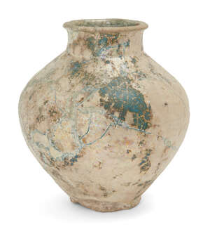 
	
		A turquoise glazed pottery vase, Iran, 14th century, of baluster form, with short foot...
