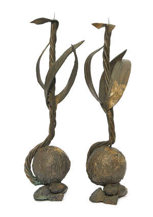 
	
		Mara Karetsos (b.1944), a pair of bronze candlesticks, c.1970, of stylised foliate form...