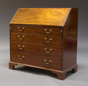 
	
		A George III style mahogany and crossbanded bureau, second half 20th Century, the fall...