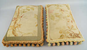 
	
		Two Aubusson tapestry cushions, the panels 19th century, with later backing and tassels,...