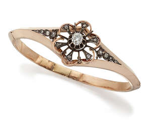 
	
		A late 19th century diamond bangle, of hinged hoop design, the openwork stylised...