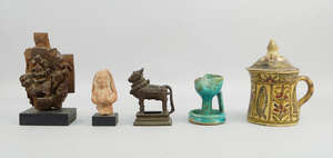 
	
		An Indian bronze model of Nandi the bull, 19th century, 11cm high, together with a Kashan...